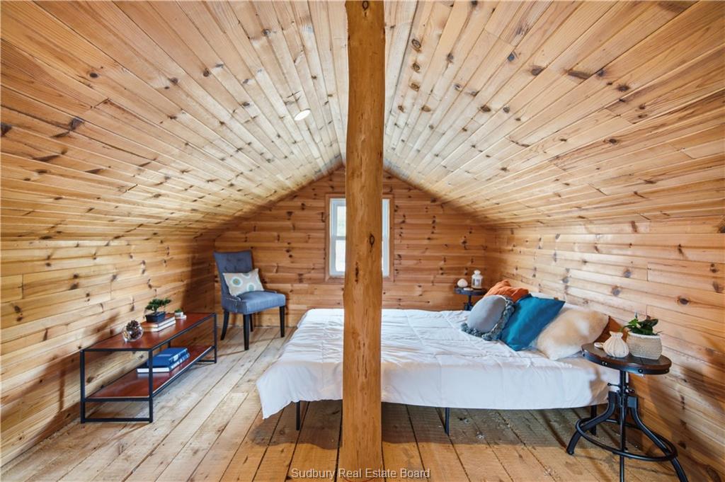 Loft with rustic wood floors