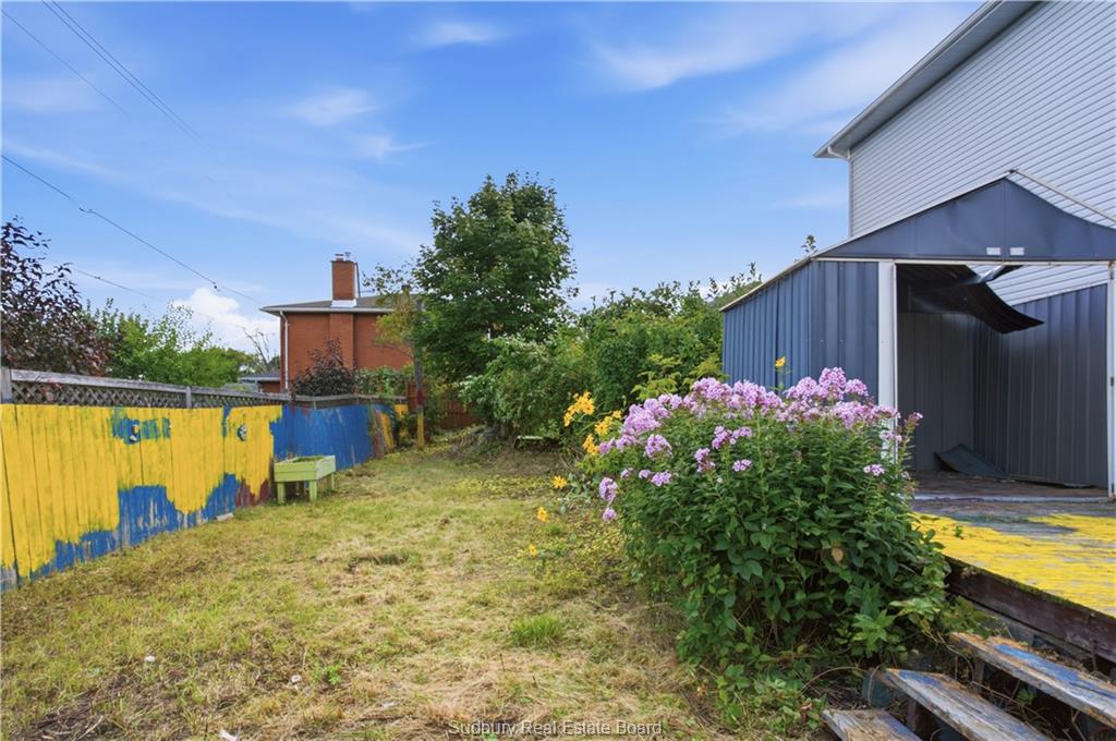 Fenced backyard and storage shed